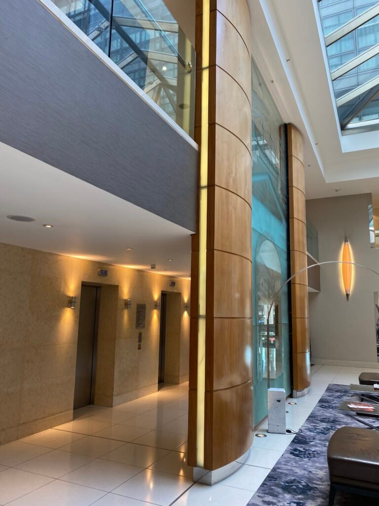 Bespoke architectural lighting supply and linear LED fixtures installed in the reception area Marriott Hotel Canary Wharf London