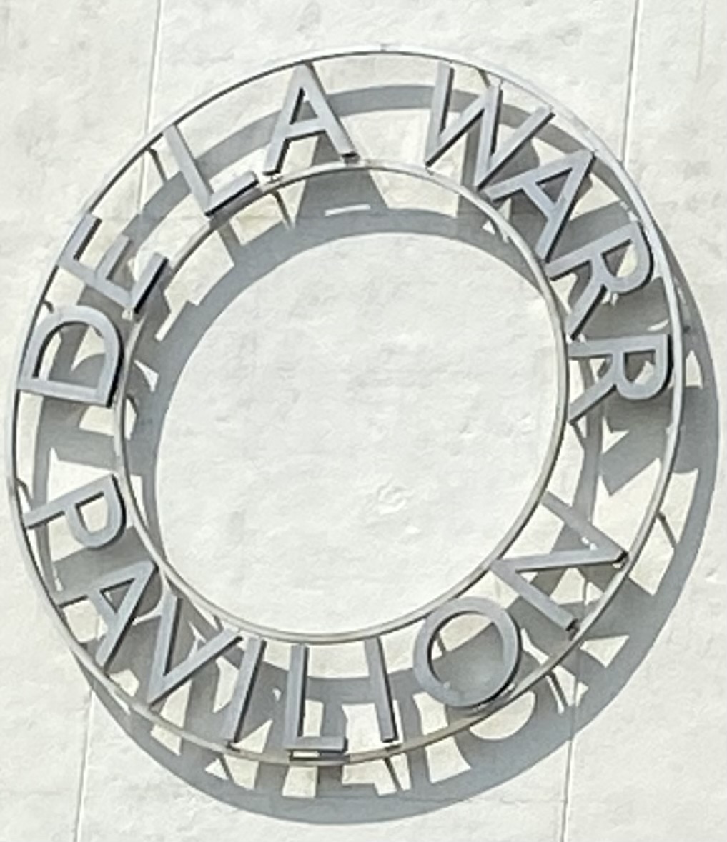 Detail of bespoke dual-illuminated circular sign with anodised aluminium finish at the De La Warr Pavilion, Bexhill.