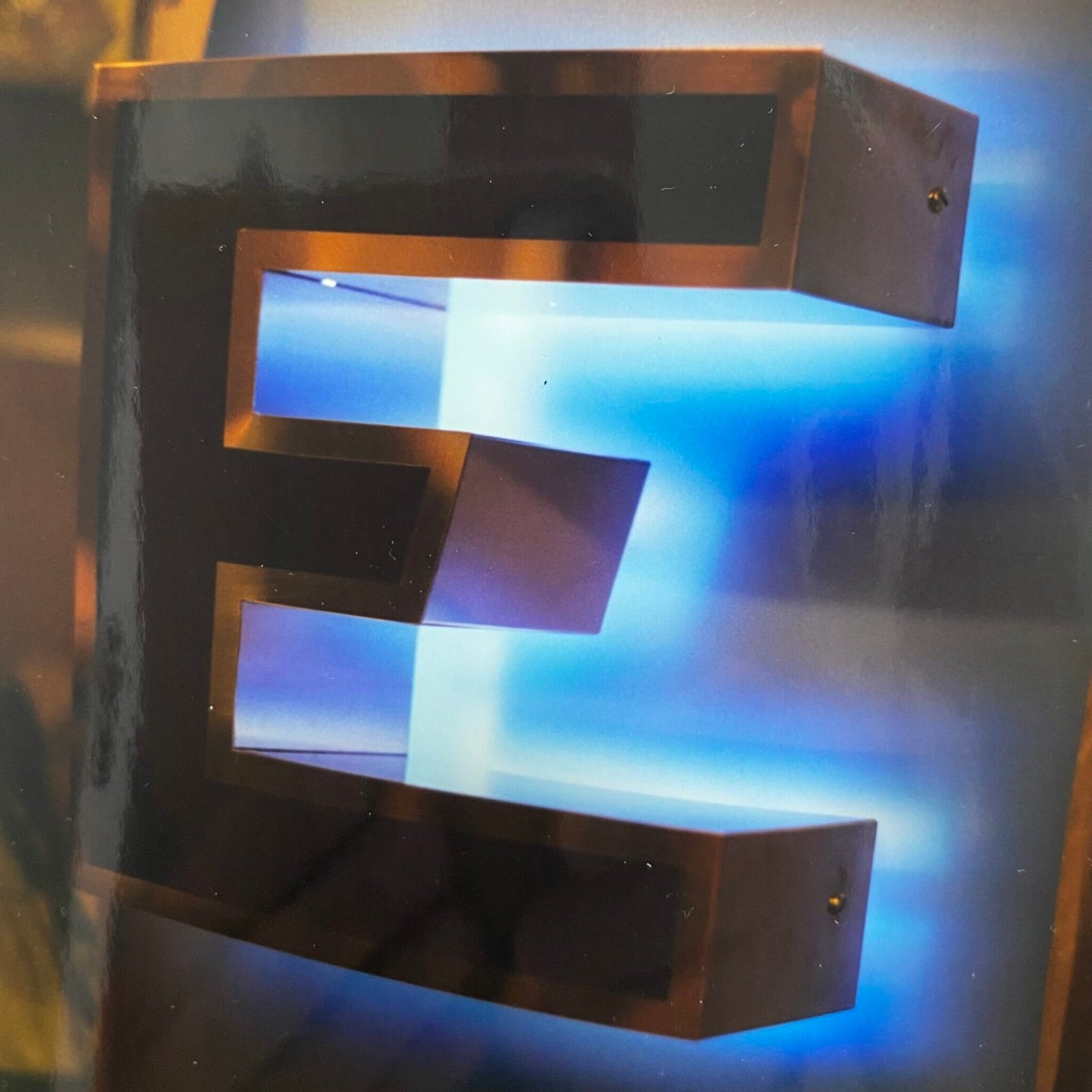 bespoke signs and neon. halo lit brass letters