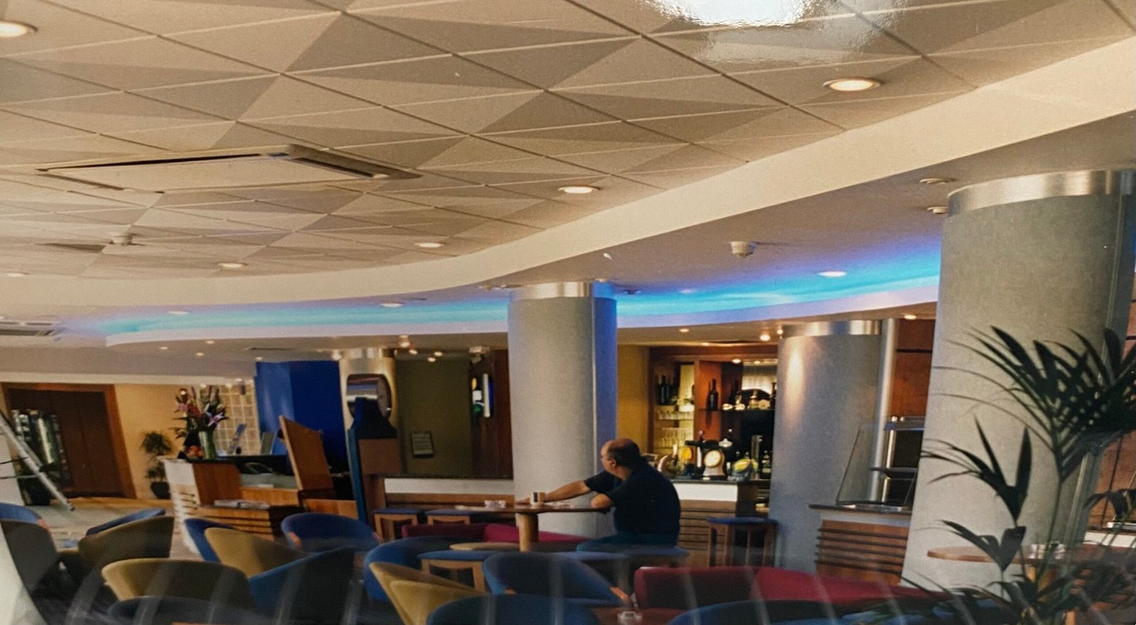 Bespoke DMX RGBW color changing LED ceiling contour lighting installation for modern commercial spaces