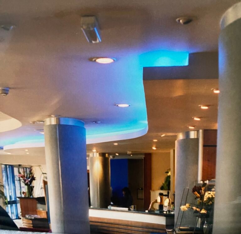 Architectural lighting supply Holiday Inn Express Hotel restaurant seating area, linear LED installation team in the UK